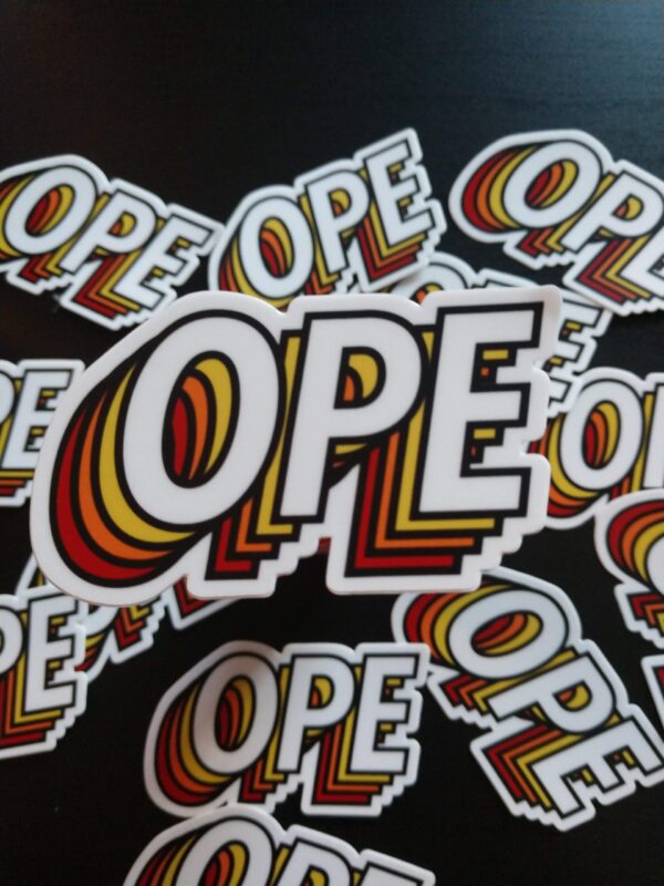 "OPE" sticker in an all-caps sans-serif font