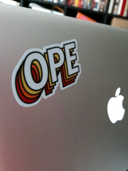 Ope Sticker on a silver laptop